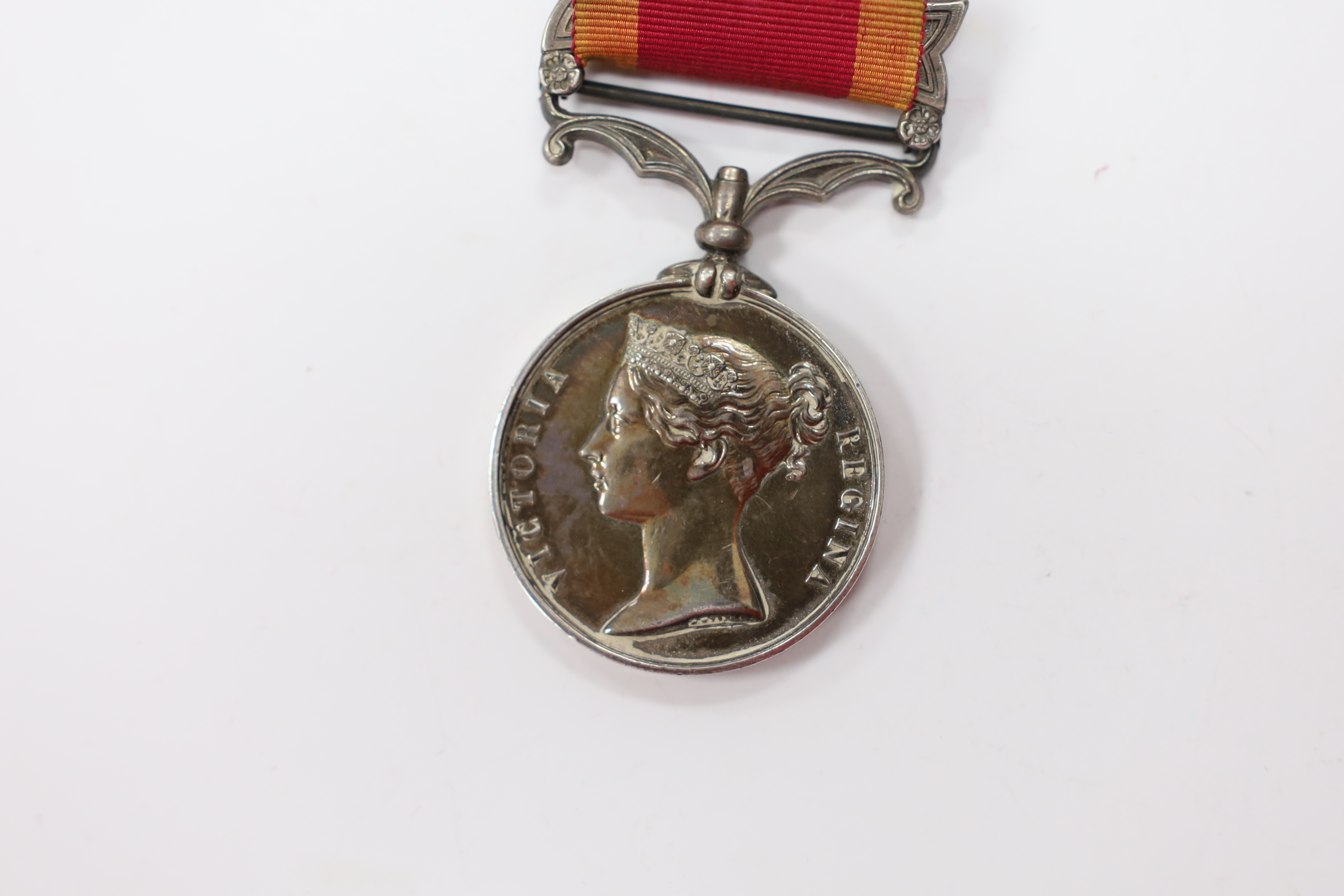 A Second China War Medal 1861 with Canton 1857 clasp, unnamed, navy issue.